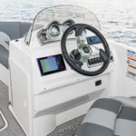 Ergonomically-designed fiberglass console with gauges, stereo, Simrad NSX7 (7” screen), and more