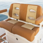 Premium helm seat with armrests and folding bolsters