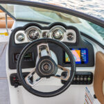 Ergonomically-designed fiberglass console with gauges, stereo, Simrad NSX7 (7” screen), and more