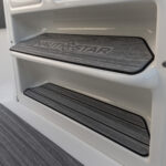 Built-in console footrests with helm mats